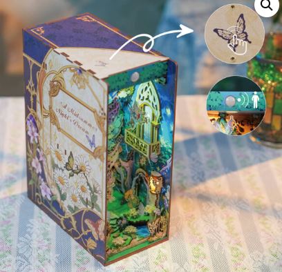 The Blue Dog Posters "A Midsummer Night’s Dream Large Book Nook Tonecheer" features floral and butterfly designs, an illuminated 3D forest scene, and a butterfly button for interactive lighting.
