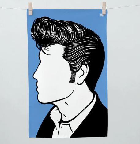 Illustration in profile of a person with a classic pompadour hairstyle, sideburns, and a collared shirt, on a blue background. The face is left blank, emphasizing the hairstyle and attire. This stylish poster clipped to a line at the top corners would pair perfectly with vintage kitchen accessories like the Rock and Pop Icons Tea Towel Elvis from Blue Dog Posters.