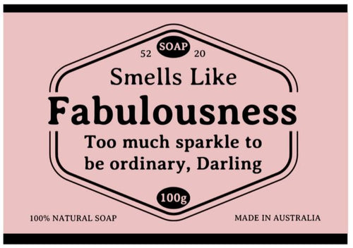 The pink label on Blue Dog Posters’ Hustle and Co Soap - Fabulousness reads: “Smells Like Fabulousness. Too much sparkle to be ordinary, Darling.” Also: “100% natural soap,” “100g,” “52 SOAP 20,” “Made in Australia.”.
