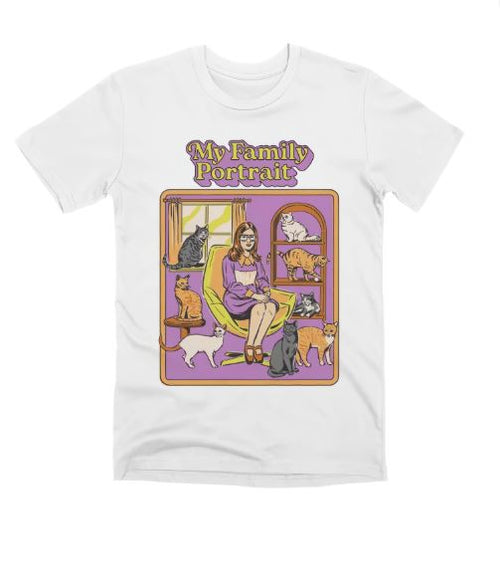 The Blue Dog Posters "My Family Portrait" T-Shirt in white (Large) features a colorful design of a woman with seven cats and decorative text, in purple, orange, and yellow.