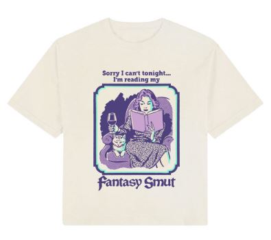The Blue Dog Posters Fantasy Smut Crop T-Shirt Cream XL features a retro fantasy-style design of a woman reading with a cat and wine, plus the phrase, "Sorry I can't tonight... I'm reading my Fantasy Smut," inspired by vintage book covers.
