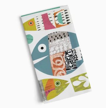 The Werkshoppe Tea Towel Fish School by Blue Dog Posters features a colorful abstract fish design with geometric patterns in vibrant green, orange, and blue hues.