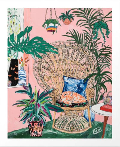 A vibrant painting titled "Ginger Cat in Peacock Chair" by Lara Lee Meintjes, from Blue Dog Posters, features a cozy indoor setting with a large peacock wicker chair adorned with blue cushions and an orange cat peacefully sleeping on them. Surrounding the chair are various potted plants, and the walls are painted a warm pink. A window with green curtains is visible in the background.