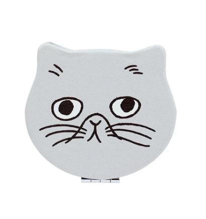 The Blue Dog Posters Compact Mirror Grey Cat Face Shape is a small, light gray cat-face accessory with large black eyes, simple nose, mouth, and whiskers—ideal for storing coins or using as a compact mirror.