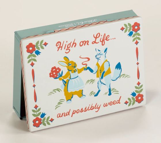 The High on Life Small Tin by Blue Dog Posters stylishly stores your compact wallet, featuring a cartoon rabbit with flowers and a fox holding a joint, plus the text "High on Life... and possibly weed" surrounded by playful floral patterns.