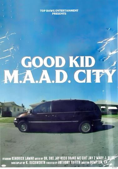 The Blue Dog Posters Kendrick Lamar Good Kid M.A.A.D. City poster shows a minivan on a suburban street under a blue sky, with the album title in bold white letters and credits at the bottom, printed on satin paper.