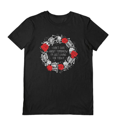 The Living For Today Black T-Shirt by Blue Dog Posters (Large) features a circular design with white skeletons and red roses, plus "I DON'T CARE ABOUT TOMORROW I'M JUST LIVING FOR TODAY" in the center—ideal for those embracing darker days.