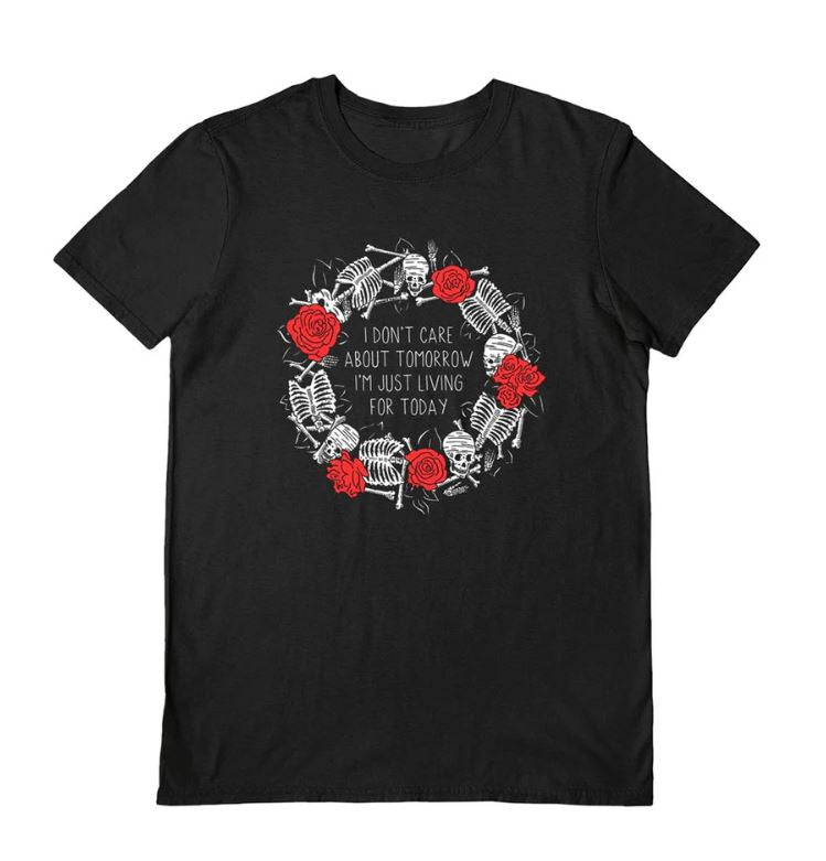 The Living For Today Black T-Shirt Small by Blue Dog Posters features a circle of white skeletons and red roses with "I don't care about tomorrow, I'm just living for today" in the center—ideal for bold, standout style on dark days.