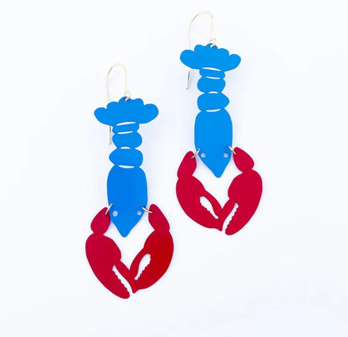 A pair of Lobster Earrings from Blue Dog Posters, designed to look like lobsters. The body of each lobster is blue, while the claws are red. These painted steel dangles have simple hooks for attaching to ears and come against a white background.