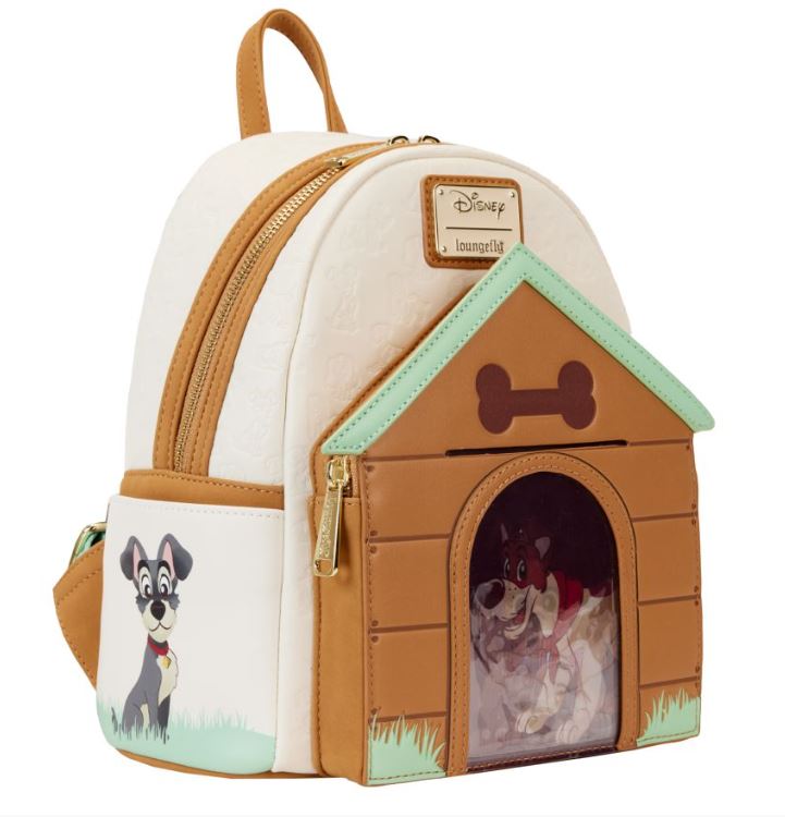Introducing the Disney I Heart Dogs Mini Backpack by Blue Dog Posters: This charming small white and beige mini backpack boasts a delightful Lady and the Tramp design. The front features a doghouse with a triple lenticular window spotlighting Lady and the Tramp. One side pocket displays an image of Tramp, while gold hardware and a top handle complete this enchanting Disney Dogs accessory.