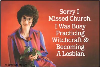 A woman with curly hair, glasses, and a purple blouse holds a plant before a red backdrop. The Blue Dog Posters "Sorry I Missed Church Magnet" reads: "Sorry I missed church. I was busy practicing witchcraft & becoming a lesbian.