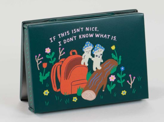 The Souvenirs From my Mushroom Trip Small Tin by Blue Dog Posters is dark green and features two mushrooms with faces and blue hats, a red backpack, flowers, a log, sparkle pebbles, and the text "If this isn't nice, I don't know what is.