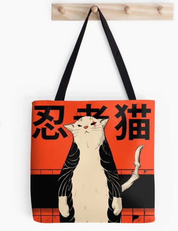 A Neko Ninja II Tote Bag from Blue Dog Posters hangs from a wooden peg. The bag showcases an illustration of a serious-faced cat dressed as a ninja, complete with a sword in its tail. The orange and black background, adorned with Japanese characters above the cat, makes it a striking addition to any giftware collection.