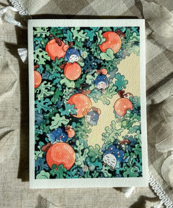 Oranges & Owls by Plain Rice Studios from Blue Dog Posters features a watercolor illustration of blue owls with orange fruits and leafy branches on recycled cotton fabric with a checkered pattern and white fringed edge.