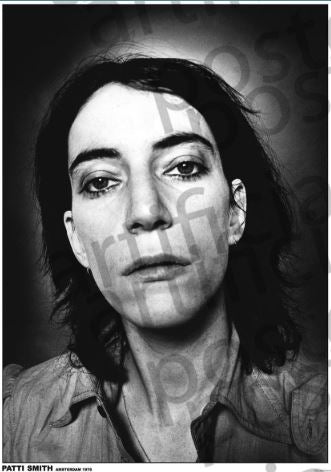 The MUS 321 "Patti Smith Amsterdam 1976" print features a grainy black-and-white close-up of Patti Smith's face, her dark hair framing a direct, neutral gaze, with a handwritten watermark evoking a classic rock poster vibe.