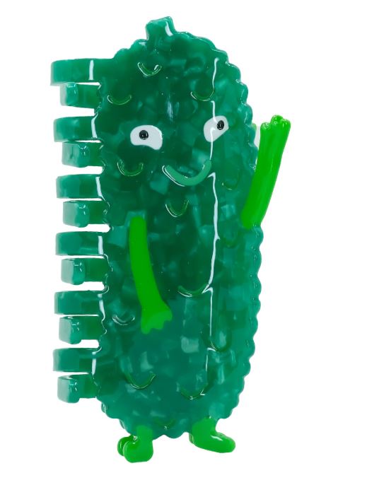 The Pickle Hair Claw by Blue Dog Posters is a green cartoon pickle hair clip with googly eyes, a smiling face, and raised arms, made from plant-based acetate—fun and eco-friendly!.