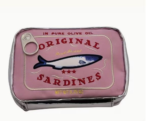 The Blue Dog Posters Sardine Tin Bag Pink is a small PU leather storage bag shaped like a sardine can, featuring a pink label, blue fish design, pull-tab detail, and "ORIGINAL SARDINES IN PURE OLIVE OIL" print.