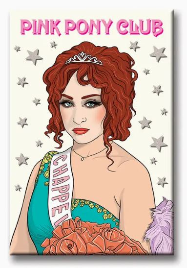 A striking illustration depicts a woman with curly red hair, adorned in a tiara and an off-shoulder dress, holding roses and a purple feather. A sash reading "CHAPPE," encircled by silver stars reminiscent of fridge magnets, graces the scene. At the top, the text "PINK PONY CLUB" adds a touch of elegance to this captivating moment. This vibrant depiction is featured on the Chappell Pink Pony Club Magnet from Blue Dog Posters.