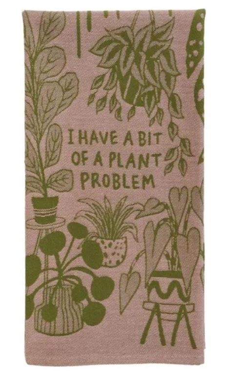 The Plant Problem Dish Towel by Blue Dog Posters is a 100% cotton tea towel featuring green potted houseplant illustrations on a pink background with “I HAVE A BIT OF A PLANT PROBLEM” at the center—perfect for plant lovers.