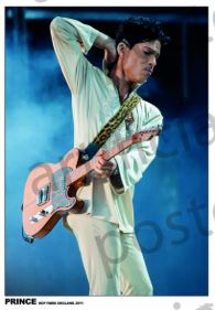 Prince, dressed in light colors, performs with an electric guitar and leopard print strap on a blue-lit, smoky stage—captured in the "Prince at Hop Farm" poster by MUS 045, perfect for any music collection.