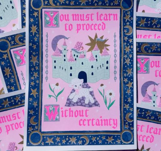 The Proceed Without Certainty A4 Risograph by Amy Hastings from Blue Dog Posters features a whimsical castle, pink towers, stars, moons, flowers, and a lamb with bold text: "You must learn to proceed without certainty." Printed on recycled coffee cup paper.