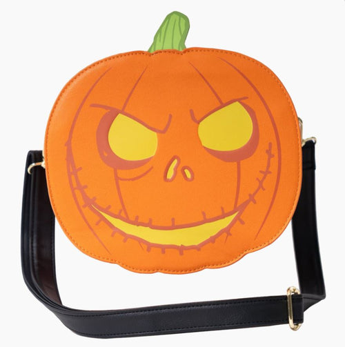 The NBX Skellington Jack O Lantern Crossbody by Blue Dog Posters is a round Halloween crossbody bag designed to resemble a Jack-o'-lantern with an orange exterior, yellow eyes, a carved sinister smile, and a green stem at the top. It features a black adjustable strap and gold hardware against a plain white background. Perfect for fans of The Nightmare Before Christmas.