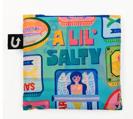 The Lil Salty Foldable Tote Bag by Blue Dog Posters features illustrated sardine tins and playful fish designs with the phrase “A Lil’ Salty”—a colorful, compact tote for carrying your essentials on the go.