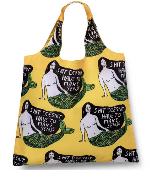 The Blue Dog Posters “Shit Doesn’t Have to Make Sense Art Sack” is a yellow recycled tote bag with bold mermaid art and the quote “SHIT DOESN’T HAVE TO MAKE SENSE” on each figure—an eco-friendly, statement shopping bag.