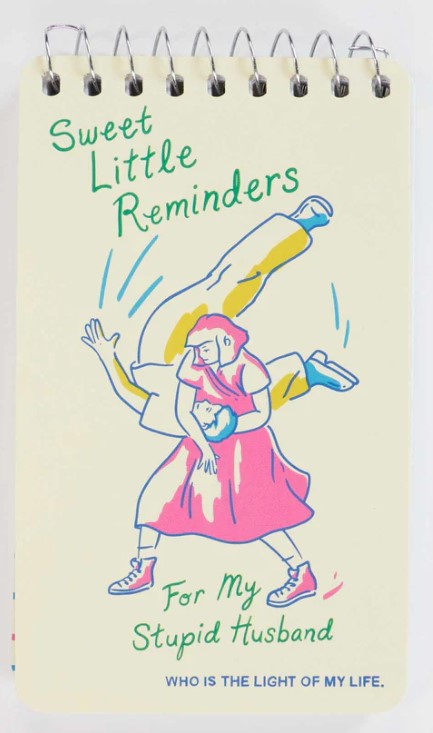 A playful Mini Notebook by Blue Dog Posters featuring a cartoon woman flipping a man, with the message: "Sweet Little Reminders For My Stupid Husband WHO IS THE LIGHT OF MY LIFE." A charming gift for your darling.