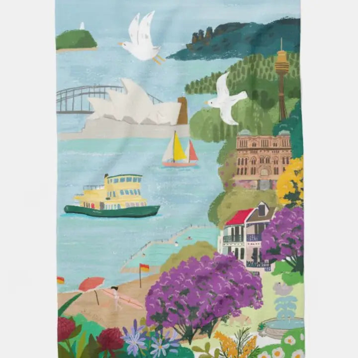 The Sydney Icons Kitchen Tea Towel by Blue Dog Posters features a colorful illustration of the Opera House, Harbour Bridge, beaches, and city landmarks—a vibrant organic cotton accent for any Australian-inspired kitchen.