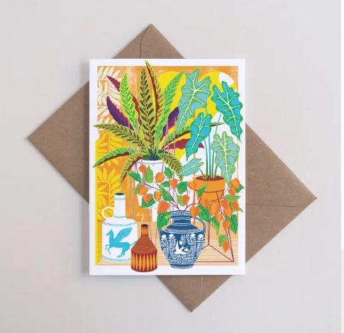 The Vessels Greeting Card by Blue Dog Posters features illustrated vases, bottles, and leafy plants in vibrant yellow, blue, orange, and green. Printed A6 size by Printer Johnson; supplied with a recycled envelope.