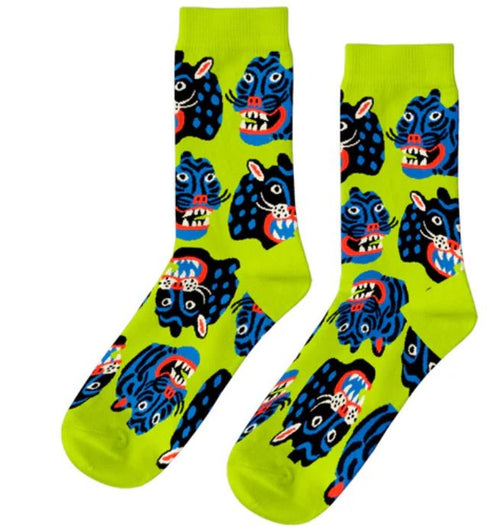 Kristina Micotti Wild Cats Womens Socks by Blue Dog Posters: bright green cotton crew socks with a bold blue and black wild cat face pattern, complete with exposed teeth and red tongues for a playful statement.