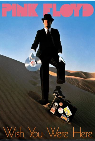 A faceless man in a suit and bowler hat stands on sand dunes, holding a vinyl record and suitcase. This premium gloss music poster features the "PINK Floyd Wish You Were Here" design by MUS 011.