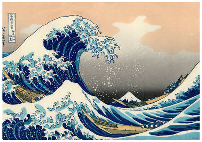 An iconic Japanese woodblock print depicted on a high quality 250gsm satin paper, this Hokusai Great wave of Kanagawa from A3 497 showcases a large, dramatic wave towering over small boats with Mount Fuji in the background. The sky transitions from pale orange to gray, creating a striking contrast with the deep blues of the waves. Available in A3 posters.