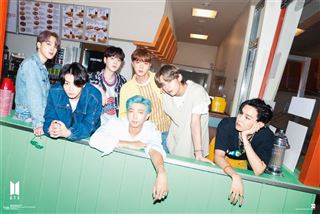 Seven young men pose together at a retro diner in the BTS - Dynamite Teaser, making this MUS Large Regular Poster a perfect addition to your music collection.