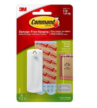 A package of Blue Dog Posters Command 3M Hanger Top Hanger 1.8kg is shown. The pack indicates it holds strongly up to 4 pounds (1.8 kg) and allows damage-free hanging. The package includes picture hanging strips, adhesive strips, and a sample application on a frame.
