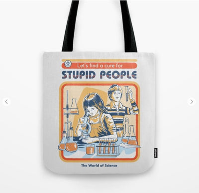 This quality blended fabric Tote Bag 40x40cm Cure for Stupid People by Blue Dog Posters features an illustration of two children in a science lab, examining test tubes and beakers. The text above reads, "Let's find a cure for STUPID PEOPLE," with "The World of Science" written below. Part of the exclusive Giftware Collection, it has sturdy black handles.