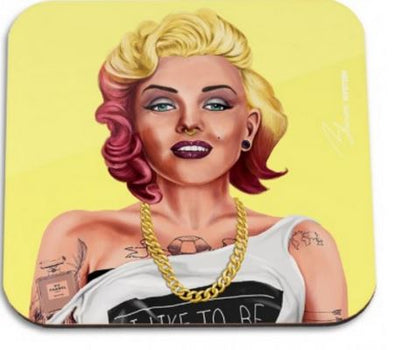 A digital illustration of a person with blonde and pink hair, wearing bold makeup, a gold chain necklace, and a white off-shoulder top with visible tattoos on their arms, perfect for adding flair to your homewares collection. The background is solid yellow. Presenting the Blue Dog Posters Hipstory Coaster Marilyn Monroe.