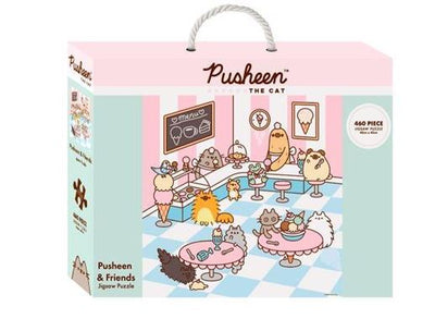 The Pusheen and Friends - 460pc Puzzle by Blue Dog Posters features an adorable illustration of Pusheen the Cat and her friends in an ice cream parlor. The pastel-colored café scene, part of our delightful Giftware Collection, showcases various cartoon animals enjoying treats and drinks. The officially licensed puzzle box also includes a white rope handle for easy carrying.