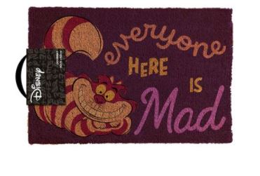 The Alice in Wonderland Mad Door Mat by Blue Dog Posters is a standout piece in any homewares collection. This maroon rectangular door mat, featuring the Cheshire Cat, is made of durable coir and displays the text "everyone here is mad" in pink, orange, and gold. It also includes a Disney tag on the left side.
