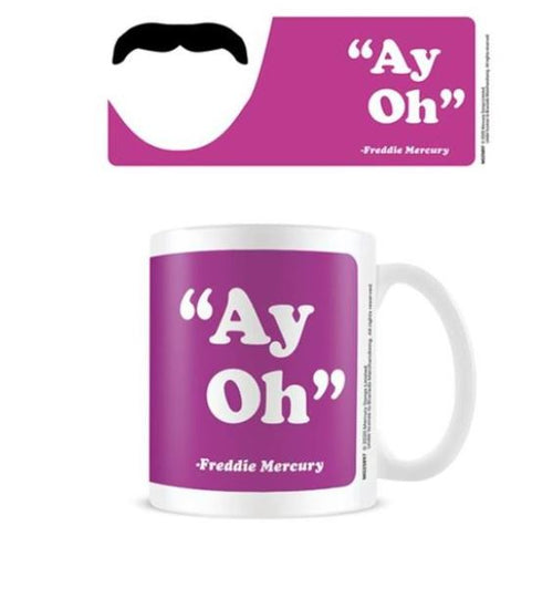A white Freddie Mercury Ay Oh Mug from Blue Dog Posters' Homewares Collection, set against a purple background, showcases the phrase "Ay Oh" in white, attributed to Freddie Mercury. Hovering above the dishwasher-safe mug is a tag that mirrors this design and text, embellished with a graphic of a black mustache and a white face outline.