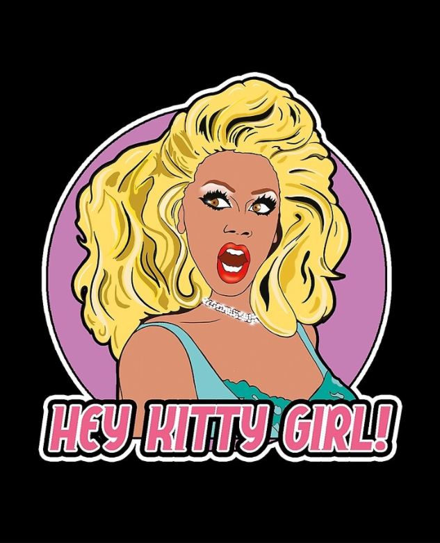 The Ru Paul Hey Kitty Girl Apron from Blue Dog Posters features a cartoon illustration of a surprised person with big blonde hair and exaggerated makeup, set against a purple circle on a black background. They are dressed in a light blue top and necklace, evoking retro polyester fashion, with the bold text "HEY KITTY GIRL!" in pink and white letters below.
