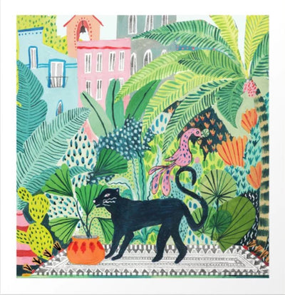 Jungle Panther by Ambers Textiles, part of the GAL56 Gallery Series, is a vibrant art print featuring a black panther, colorful parrot, and lush greenery with colorful buildings in the background. Printed on high-quality archival paper.
