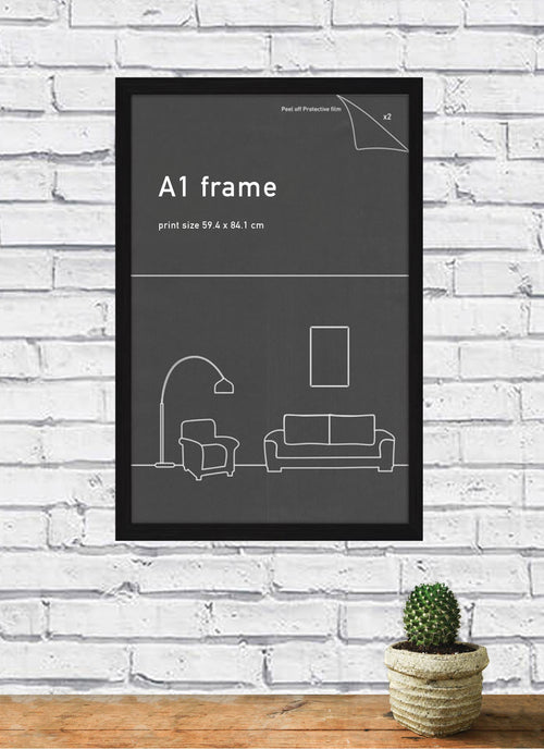 A brick wall features a Blue Dog Posters' Classic Frame A1 Black containing a framed poster with minimalistic illustrations of a floor lamp, armchair, sofa, and picture frame. Below the poster, there's a small round table with a potted cactus on it.