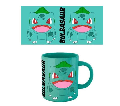 Presenting the Pokemon Bulbasaur Coloured Mug by Blue Dog Posters: a teal mug adorned with an illustration of the Pokémon Bulbasaur. The design showcases Bulbasaur's face and upper body with an open mouth, both on the officially licensed mug and in the matching graphic above it, complemented by the name "BULBASAUR" written vertically beside the image.