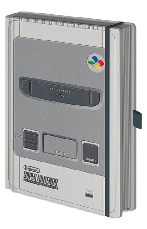The Nintendo SNES A5 Premium Notebook by Blue Dog Posters is designed to resemble the top of a Super Nintendo Entertainment System (SNES) console in the PAL version. It features power and reset buttons, a cartridge slot, and includes a colored logo in the top-right corner. Plus, it has a pen holder on the right side. This notebook is perfect for stationery gifts.