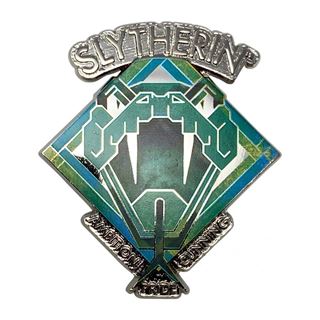 Presenting the Harry Potter Slytherin Pin Badge by Blue Dog Posters: a limited edition metal pin showcasing the iconic Slytherin house emblem from the Harry Potter series. The design features a stylized serpent and inscriptions of "Ambition," "Cunning," and "Pride" beneath the emblem, with "Slytherin" elegantly written at the top in silver.