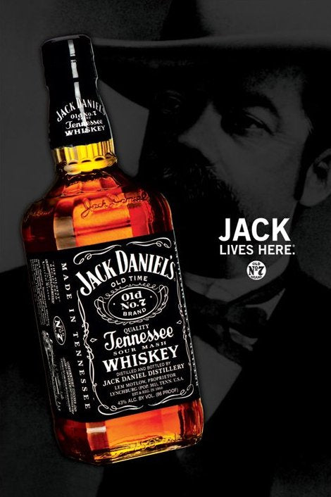 A bottle of Jack Daniels lies on its side in the foreground, with a grayscale portrait of a mustached, hat-wearing man behind it. "JACK LIVES HERE." appears in bold. Printed by ALT on premium 150gsm gloss paper.