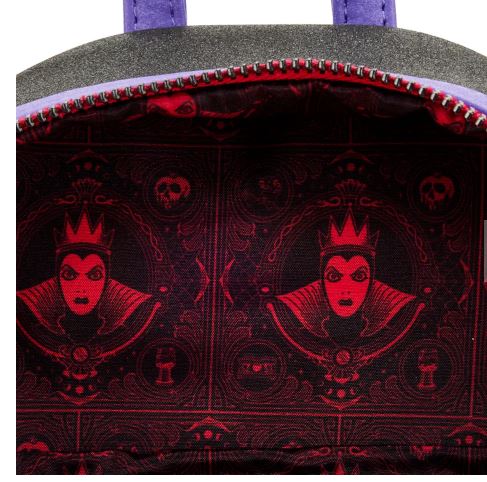 Image showing the inside of a Snow White Evil Queen Apple Mini Backpack by Blue Dog Posters. The dark red and black lining features an illustrated face of an angry queen wearing a crown on a dark background. The bag has purple straps, a zipper, and matches perfectly with the Villains Scenes Mini Backpack collection.